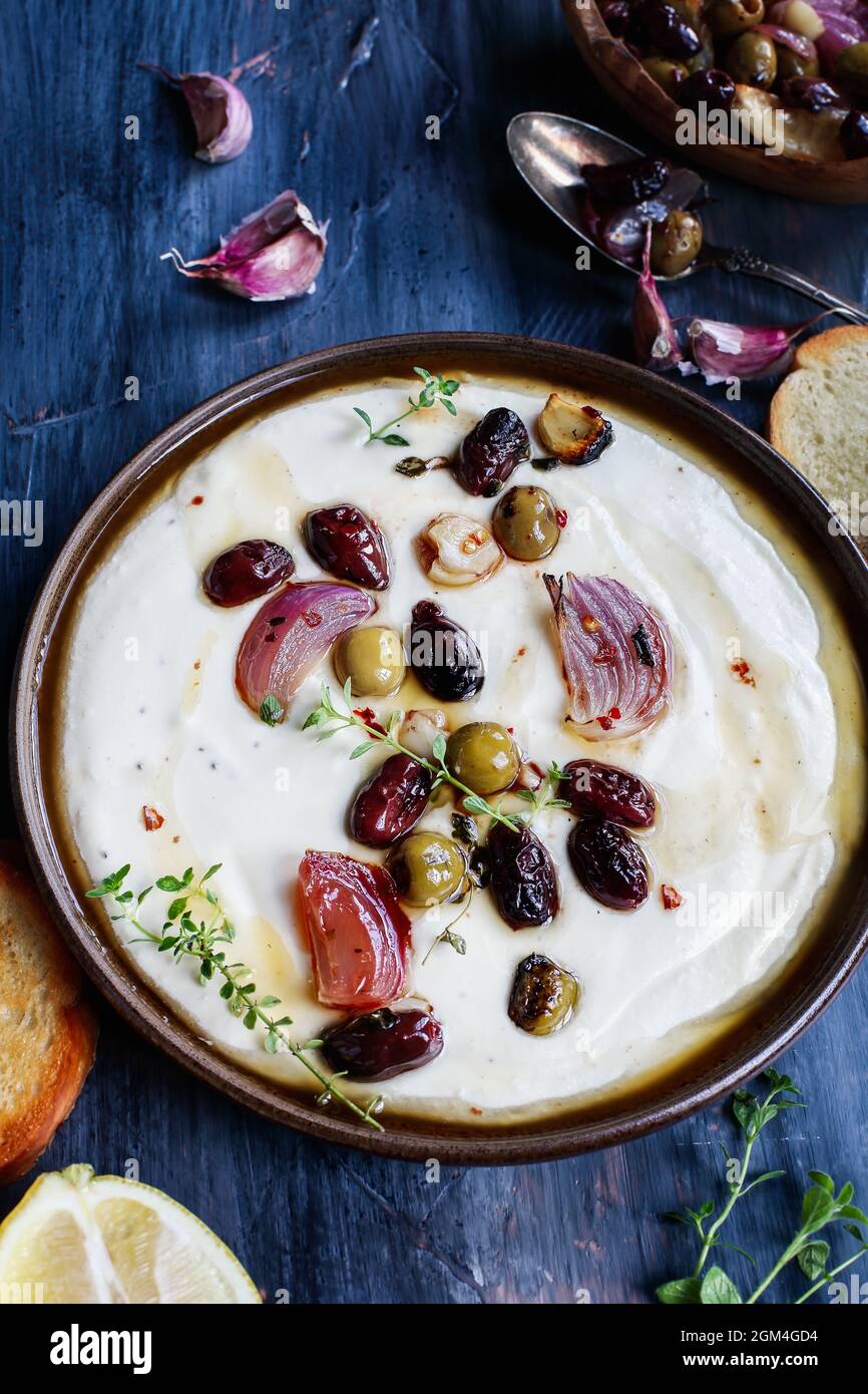 Greek feta cheese dip, Tirokafteri, with roasted olives, garlic, red