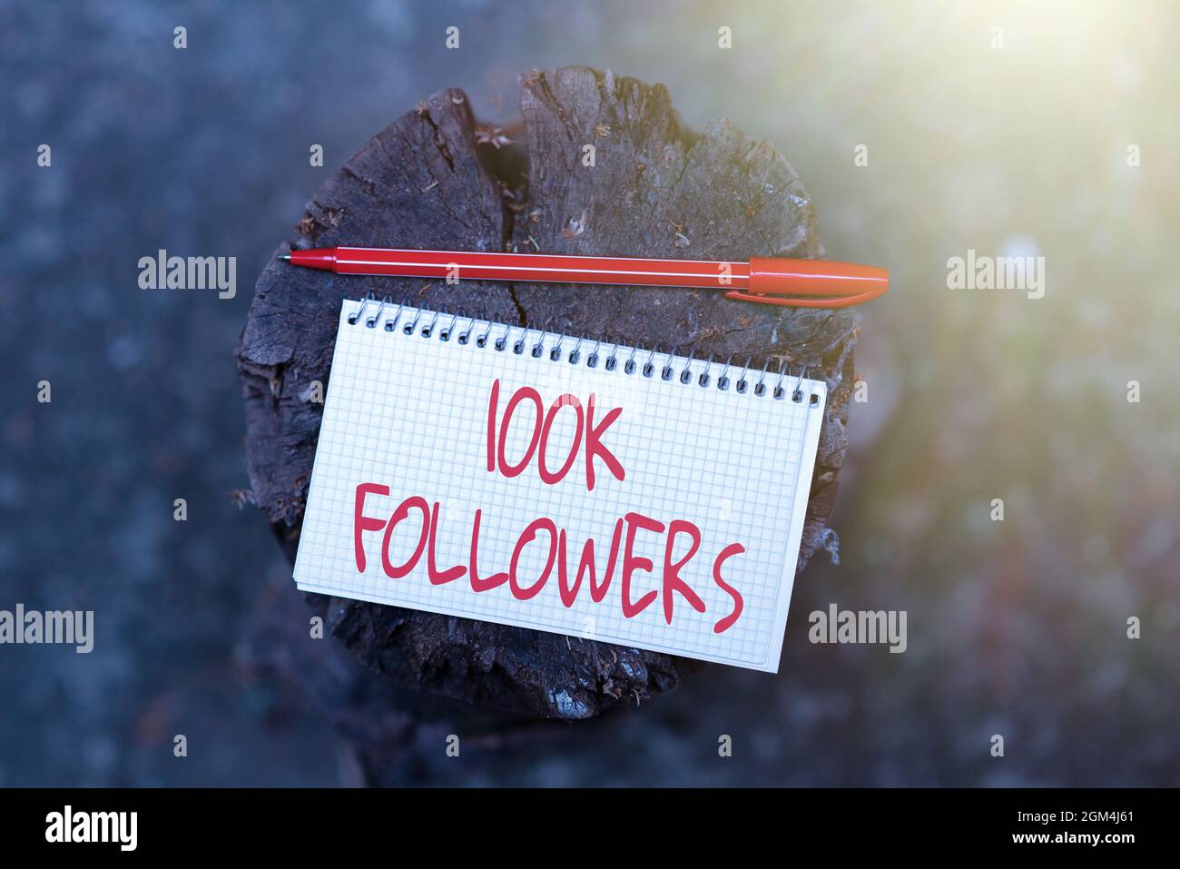 Hand writing sign 100K Followers. Word Written on number of individuals ...