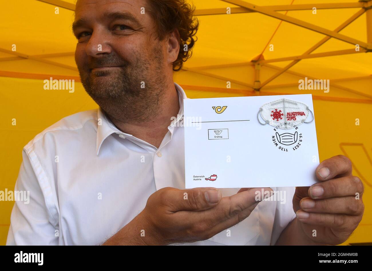 Vienna, Austria. 16th Sep, 2021. A staff member of the Austrian Post shows an envelope with a Mini FFP2 mask special stamp in Vienna, Austria, on Sept. 16, 2021. The Austrian Post issued a Mini FFP2 mask special stamp on Thursday, aimed at reminding people about using FFP2 masks to help protect against infection. Credit: Guo Chen/Xinhua/Alamy Live News Stock Photo