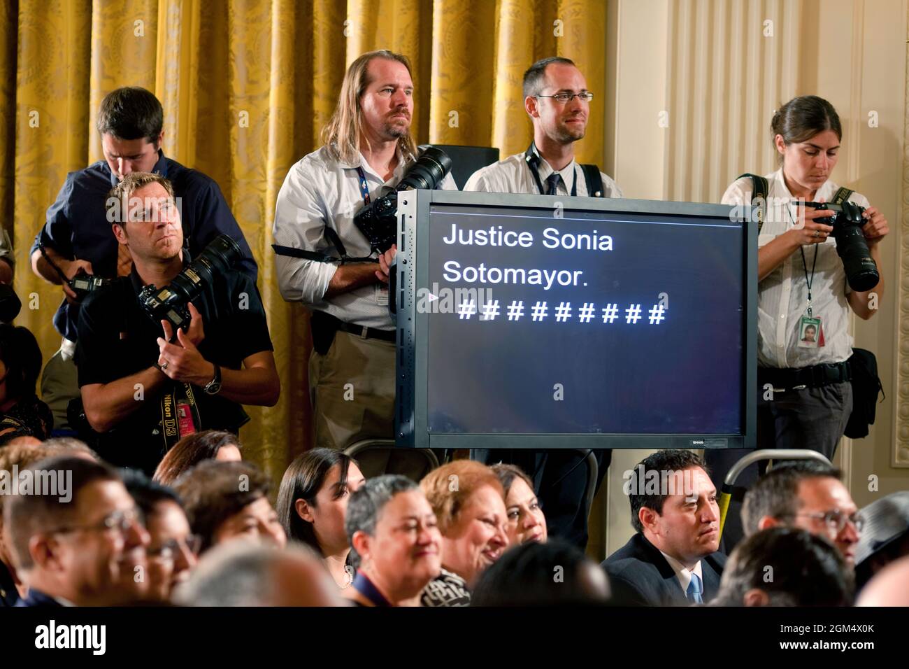 Photojournalists wait for the start of a reception for new Supreme Court Justice Sonia Sotomayor in the East Room of the White House, August 12, 2009. (Official White House Photo by Pete Souza) This official White House photograph is being made available only for publication by news organizations and/or for personal use printing by the subject(s) of the photograph. The photograph may not be manipulated in any way and may not be used in commercial or political materials, advertisements, emails, products, promotions that in any way suggests approval or endorsement of the President, the First Fam Stock Photo