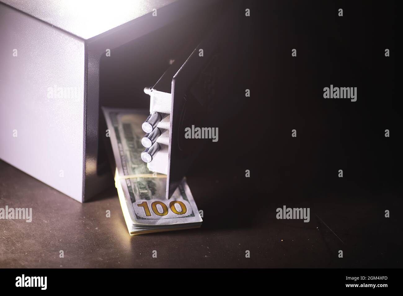 Steel safe with money. Hand putting password in the safety money box in  hotel room Stock Photo - Alamy