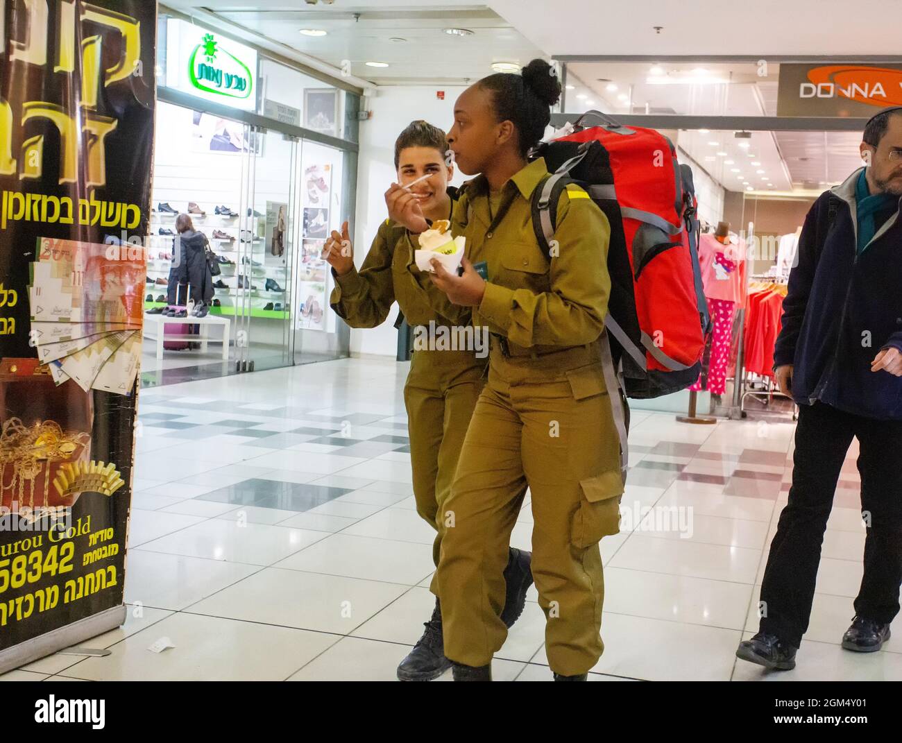 12-25-2014  Jerusalem.  Girls - israeli soldgers  -  in shop eating ice-cream Stock Photo