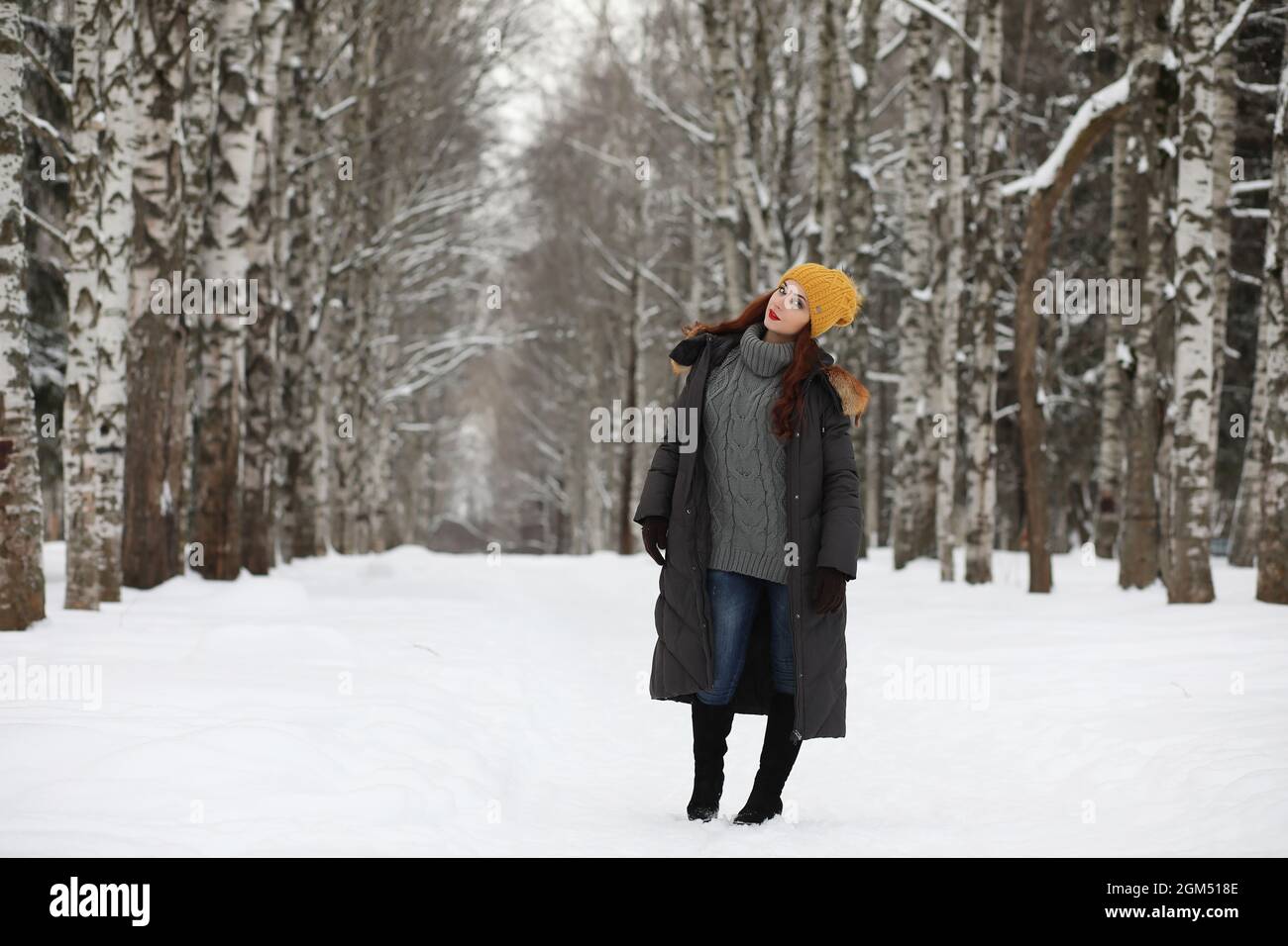 Beautiful girl in a beautiful winter park for a walk Stock Photo - Alamy