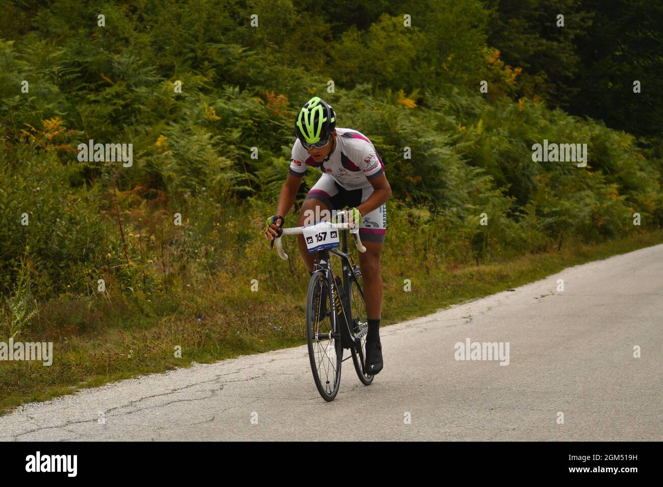 The time trial bicycle race took place in the hilly terrain Stock Photo ...
