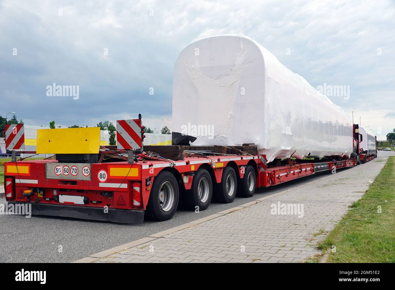 Oversize load or exceptional convoy. A truck with a special semi-trailer for transporting oversized loads. Very long vehicle. Stock Photo