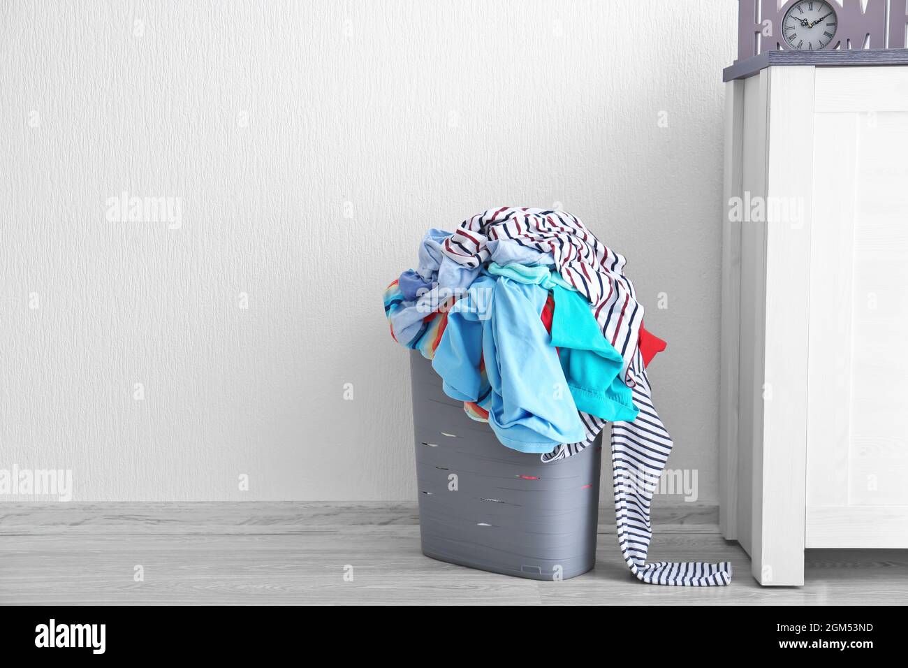 Basket with dirty laundry indoors Stock Photo Alamy