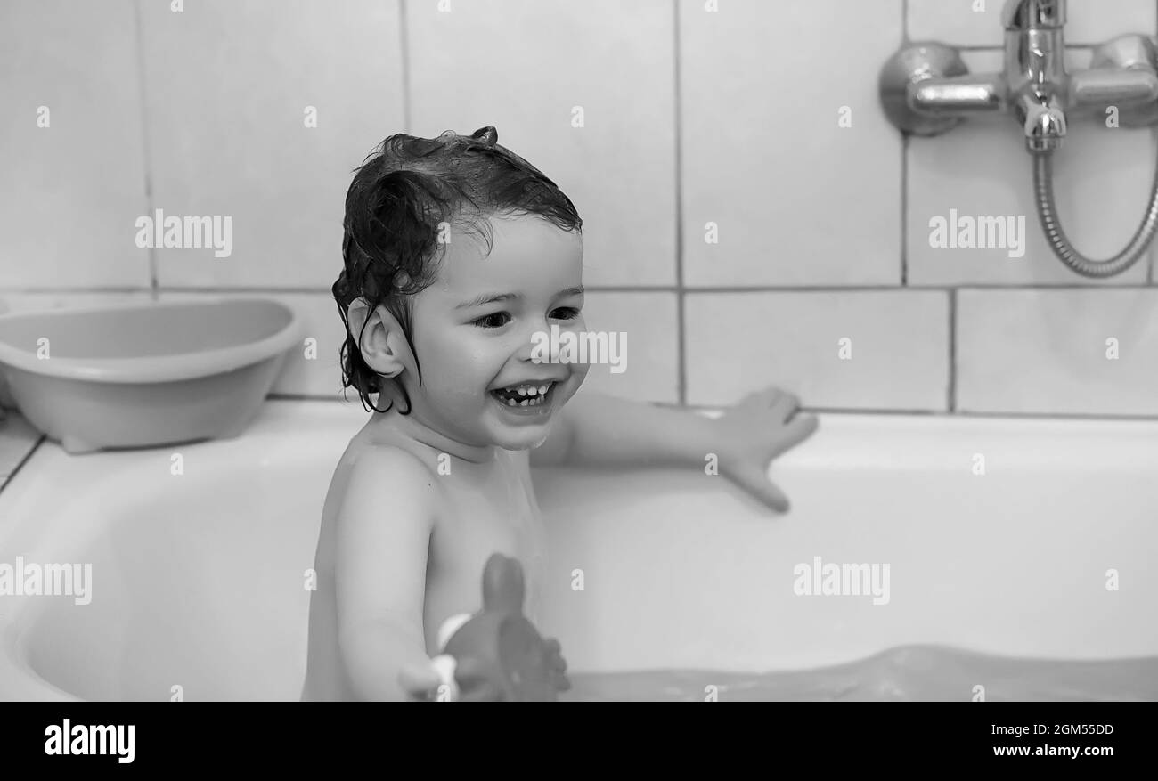 Two children in bath Black and White Stock Photos & Images - Alamy