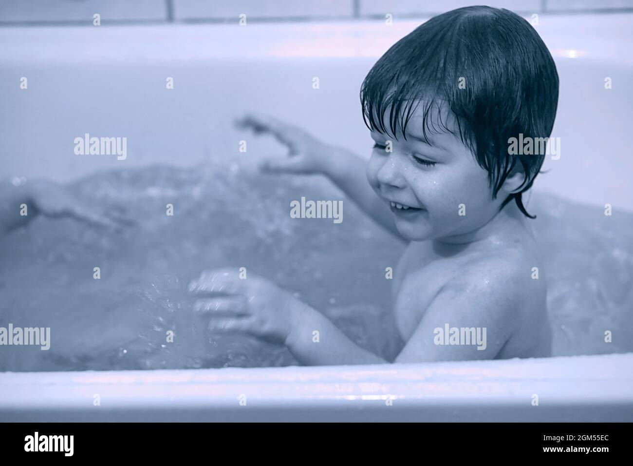 Young children take a bath. Children wash in bathroom. Brother and