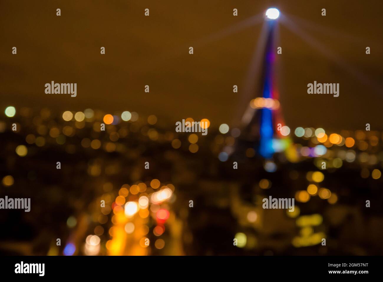 Abstract artsy blurred image of the Eiffel Tower in rainbow colors honoring the 2024 Olympics. Stock Photo