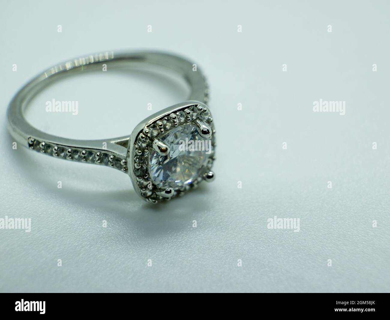 macro close-up photo silver diamond wedding ring Stock Photo