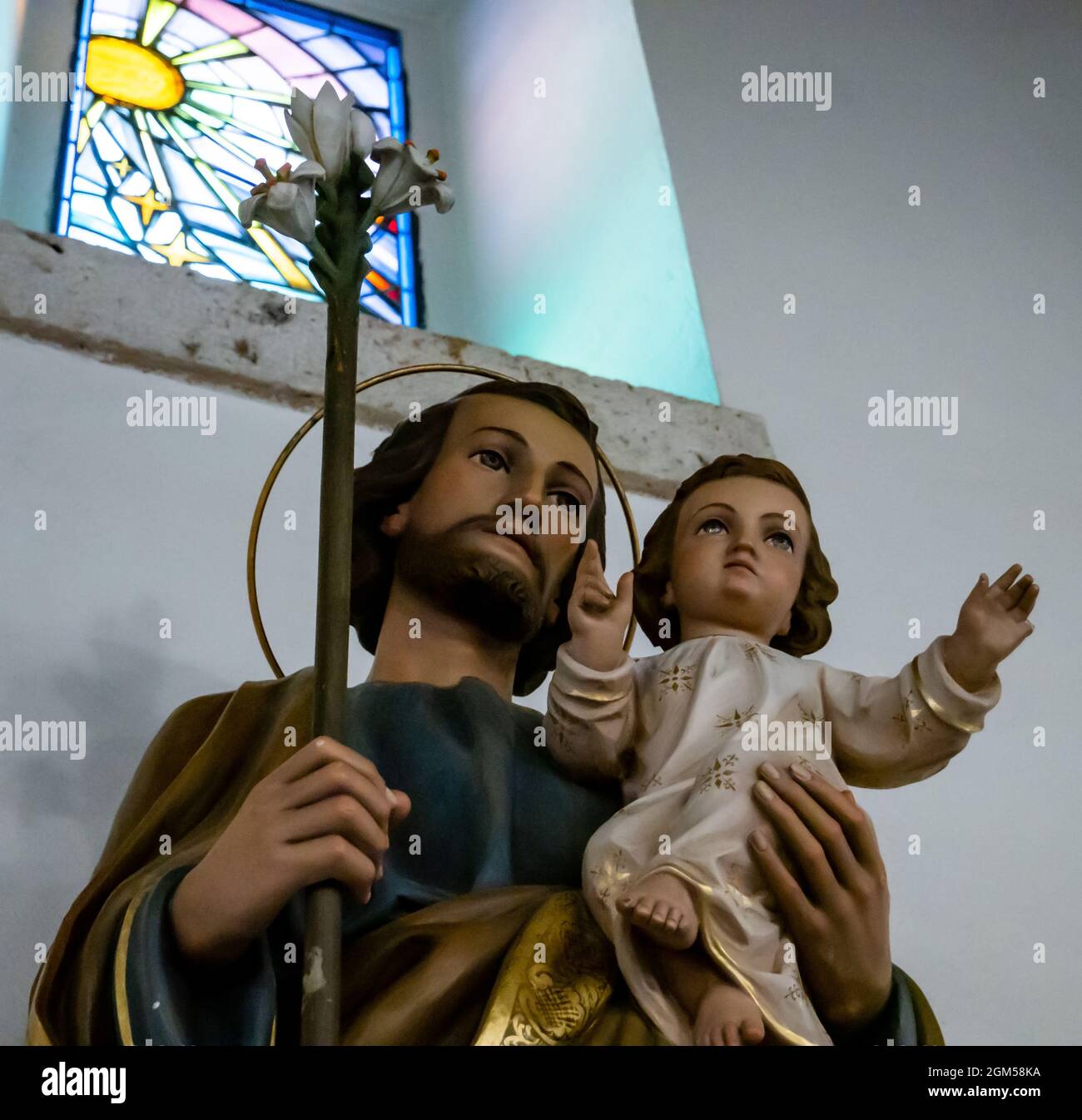 statue of saint joseph holding his son jesus christ Stock Photo