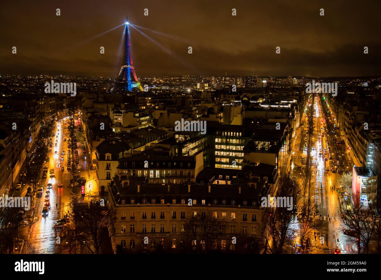 Lovely Paris Nighttime Panoramic Scenery with rainbow Eiffel Tower and Other Popular Places glowing gold Stock Photo