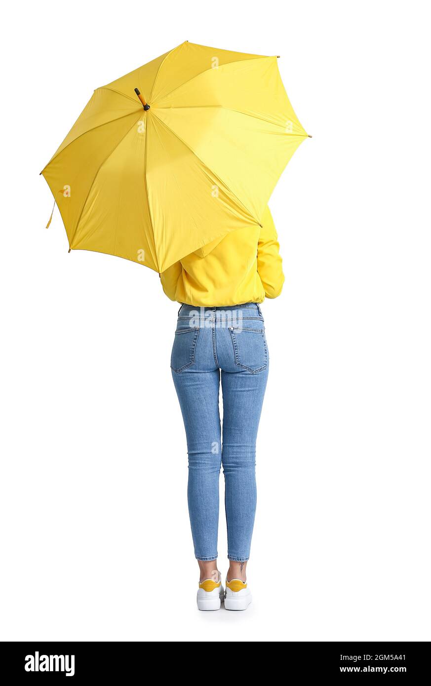 Beautiful young woman with umbrella on grey background Stock Photo - Alamy