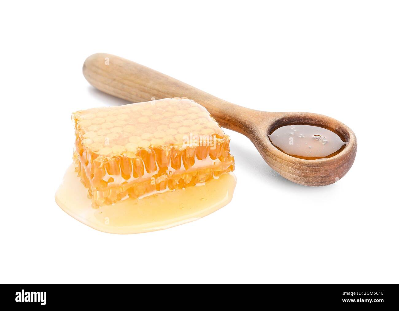 Organic honey comb and spoon on white background Stock Photo - Alamy