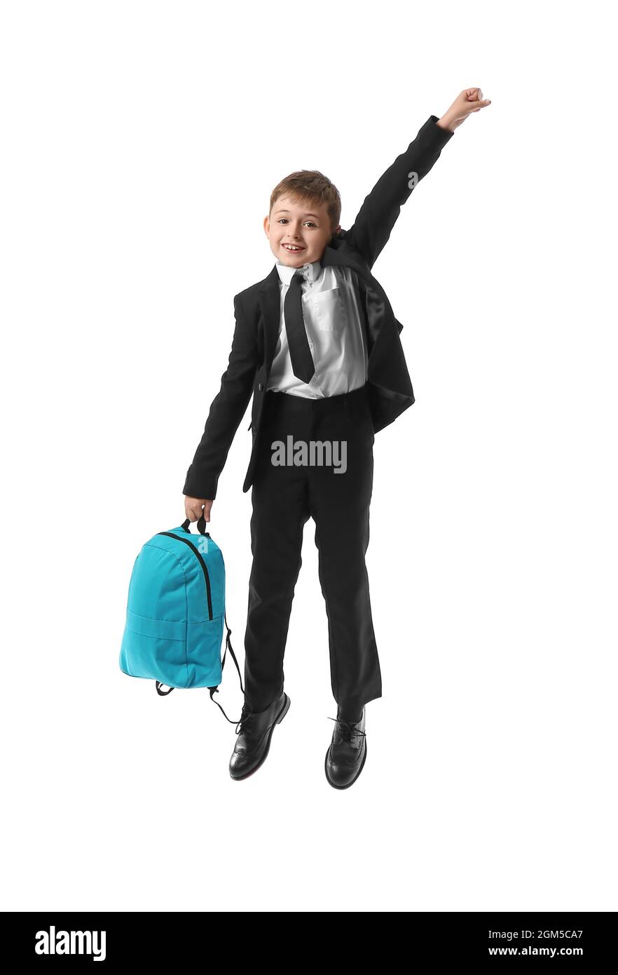 Jumping little schoolboy with backpack on white background Stock Photo ...