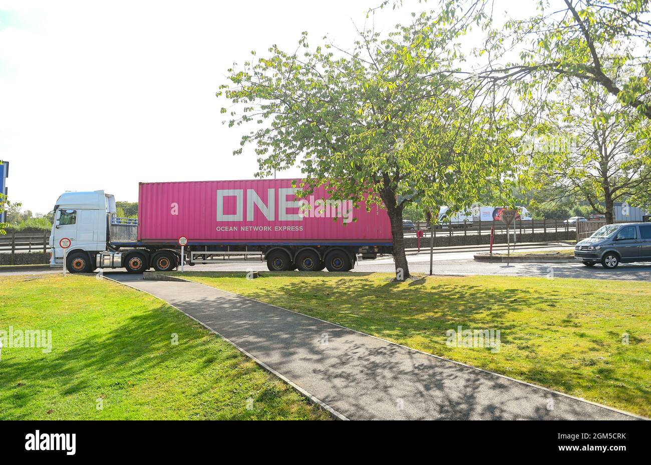 ONE , ocean network express HGV leaving Rownhams services on the M27 near Southampton on its way to continue its journey delivering freight. Stock Photo