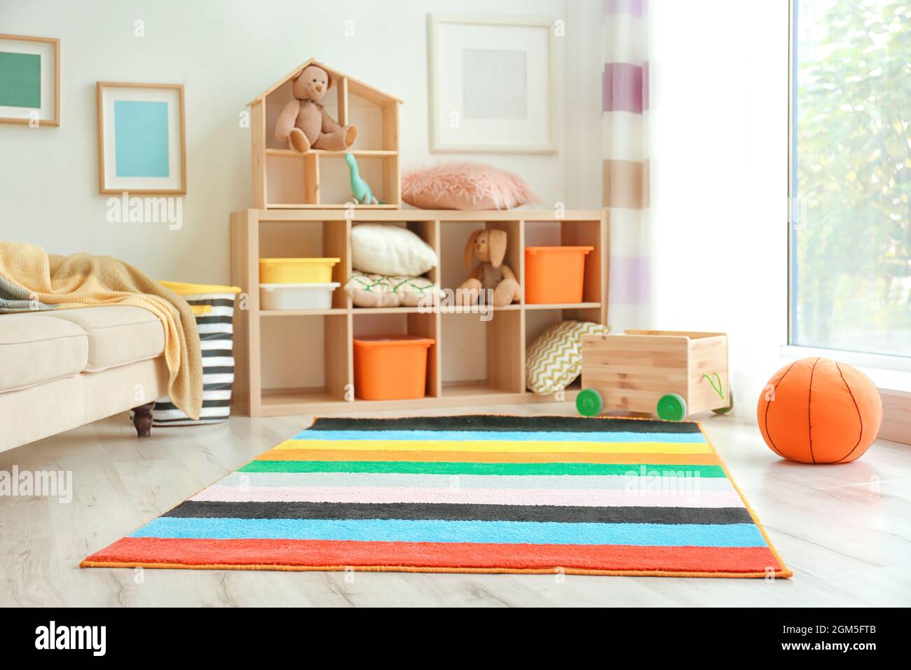Interior of child's room with colorful carpet Stock Photo Alamy
