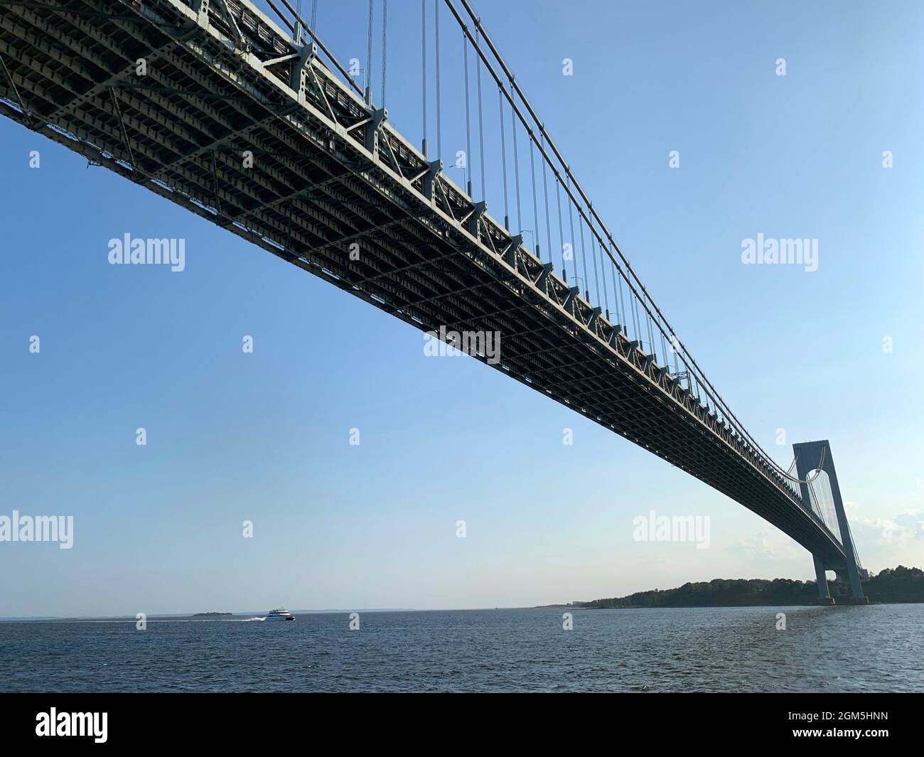 The spectacular Verrazzano bridge from the boat below under it in New York City Stock Photo