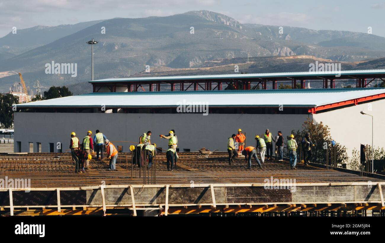 Engineers and workers working on a construction site Stock Photo