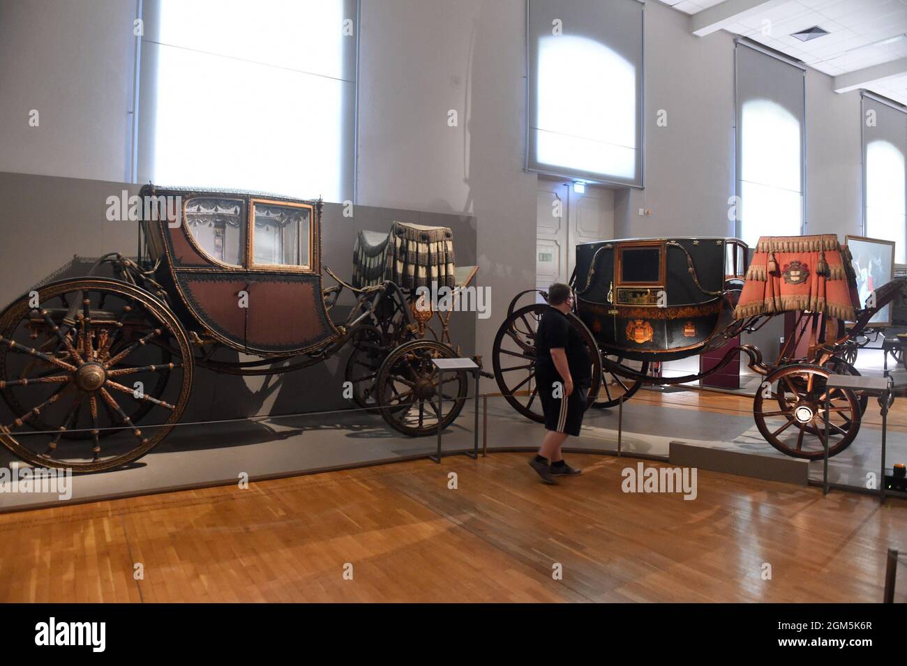 Vienna, Austria. 16th Sep, 2021. A man visits the Imperial Carriage Museum in Vienna, Austria, on Sept. 16, 2021. The Imperial Carriage Museum presents carriages and exquisite items of clothing of the Habsburgs. The remains of the more than 600 vehicles of the fleet used by the Viennese court are kept in the museum. Credit: Guo Chen/Xinhua/Alamy Live News Stock Photo