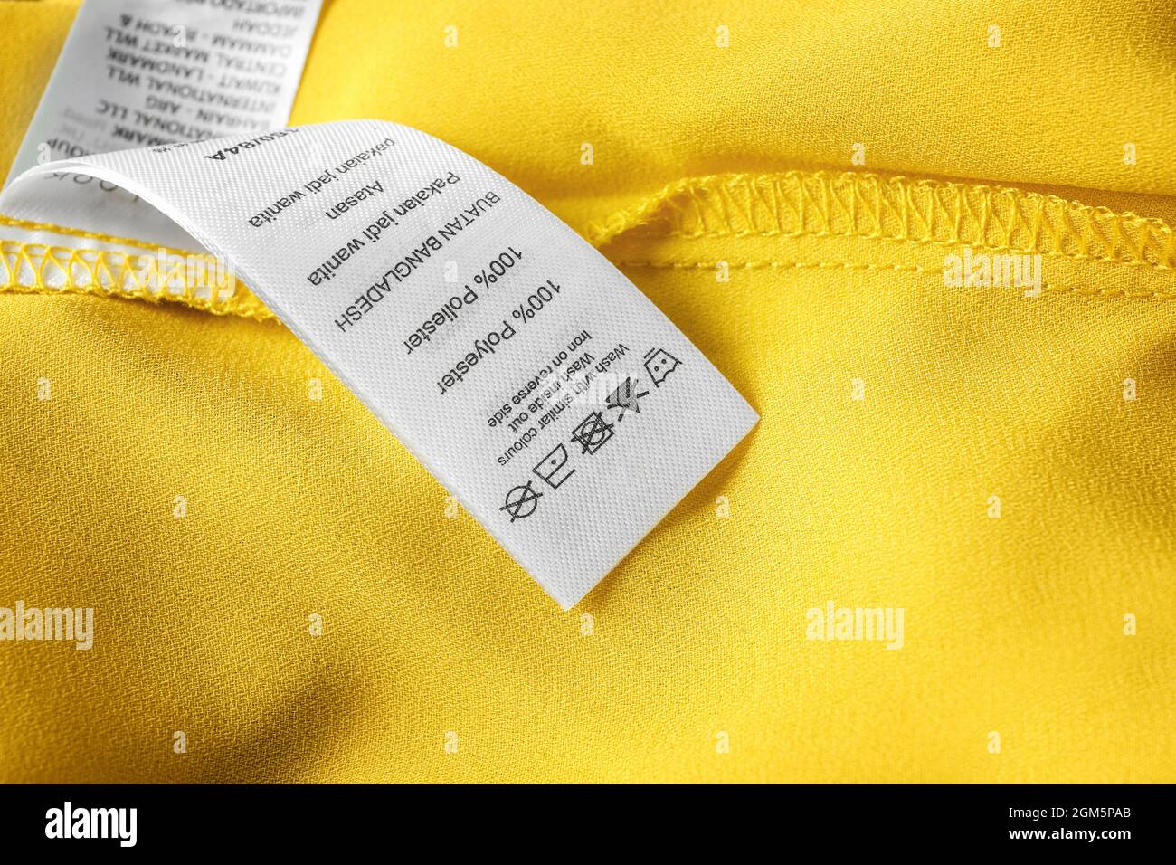 Clothing label with laundry instructions, closeup Stock Photo - Alamy