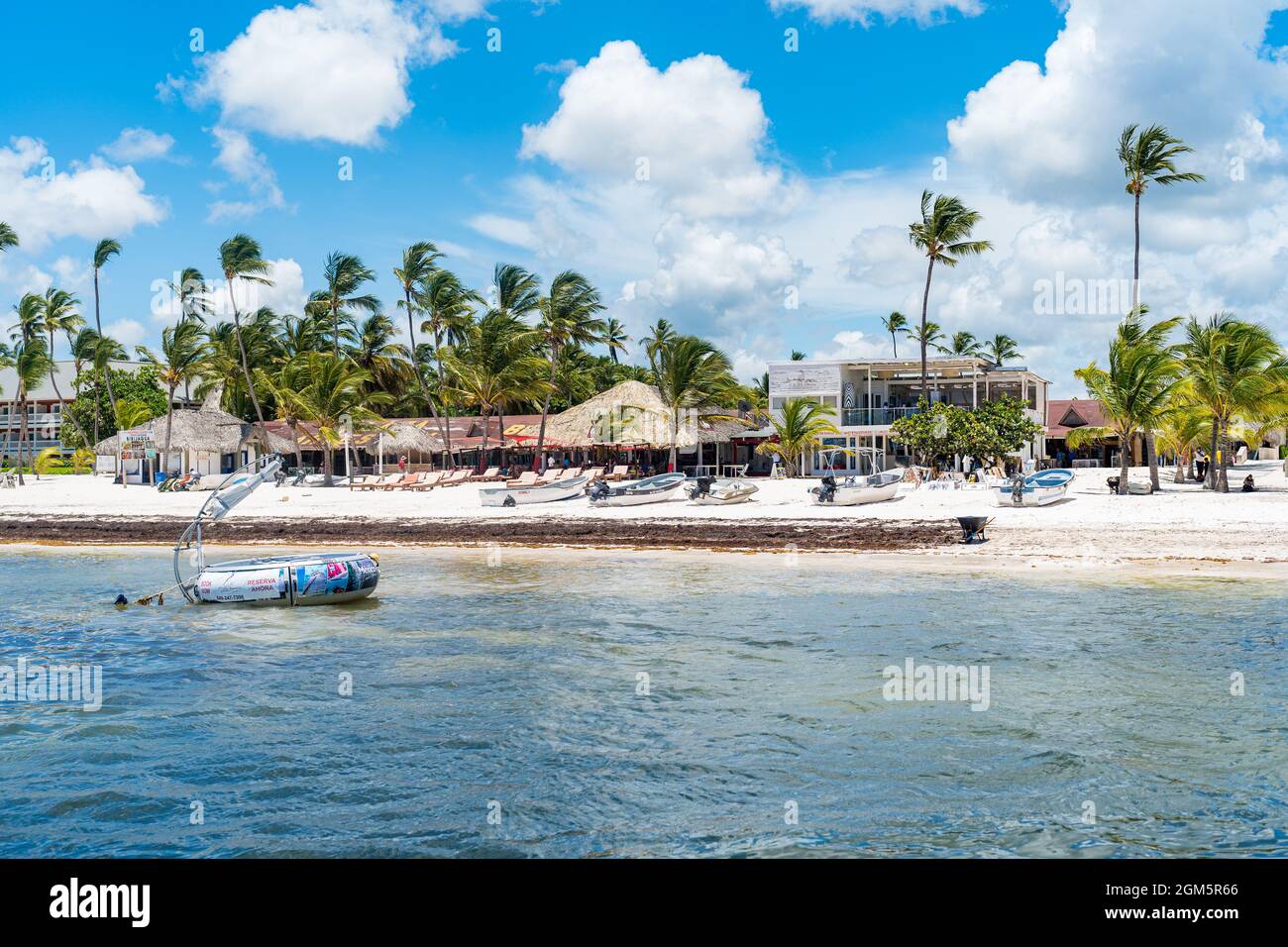 Dominican Republic Beach Market with Palm Trees and Water Sports Attractions. Stock Photo