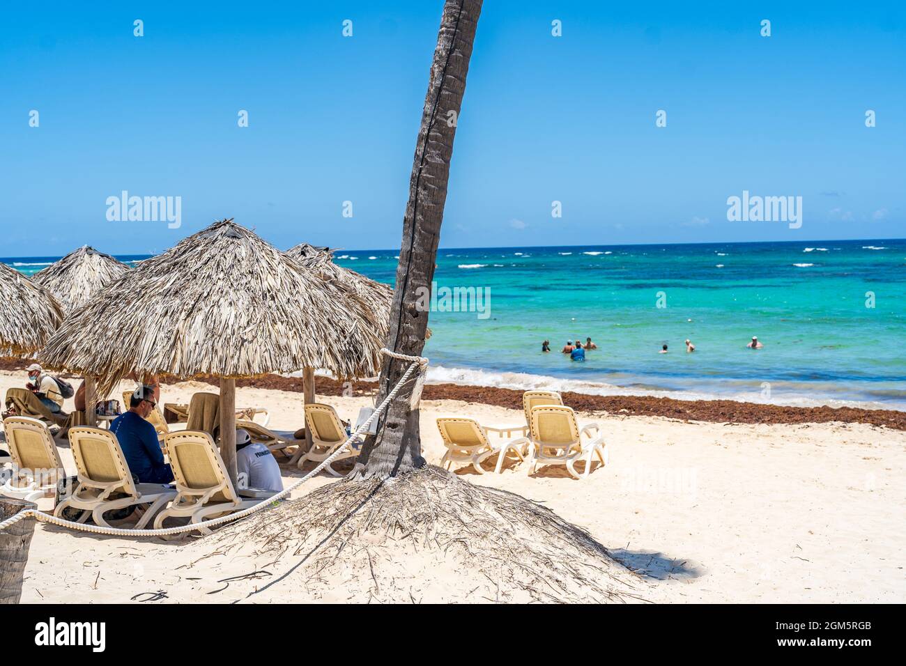 Punta Cana, Dominican Republic - August 5, 2021: Relaxing Beach with Huts in the Dominican Republic. Stock Photo