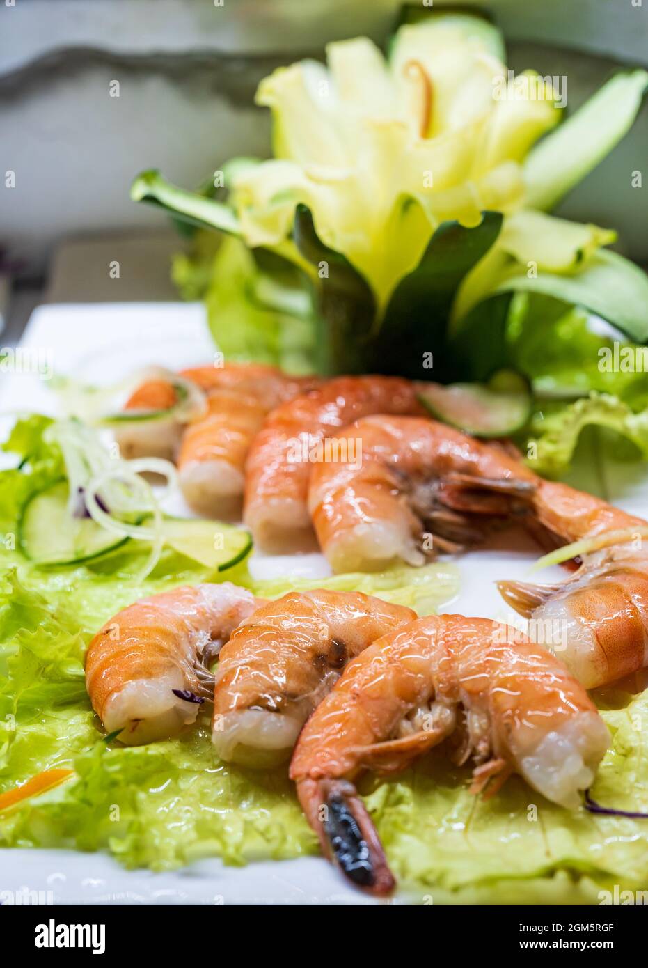 Delicious Shrimps Garnished with Salad and Vegetables. Stock Photo