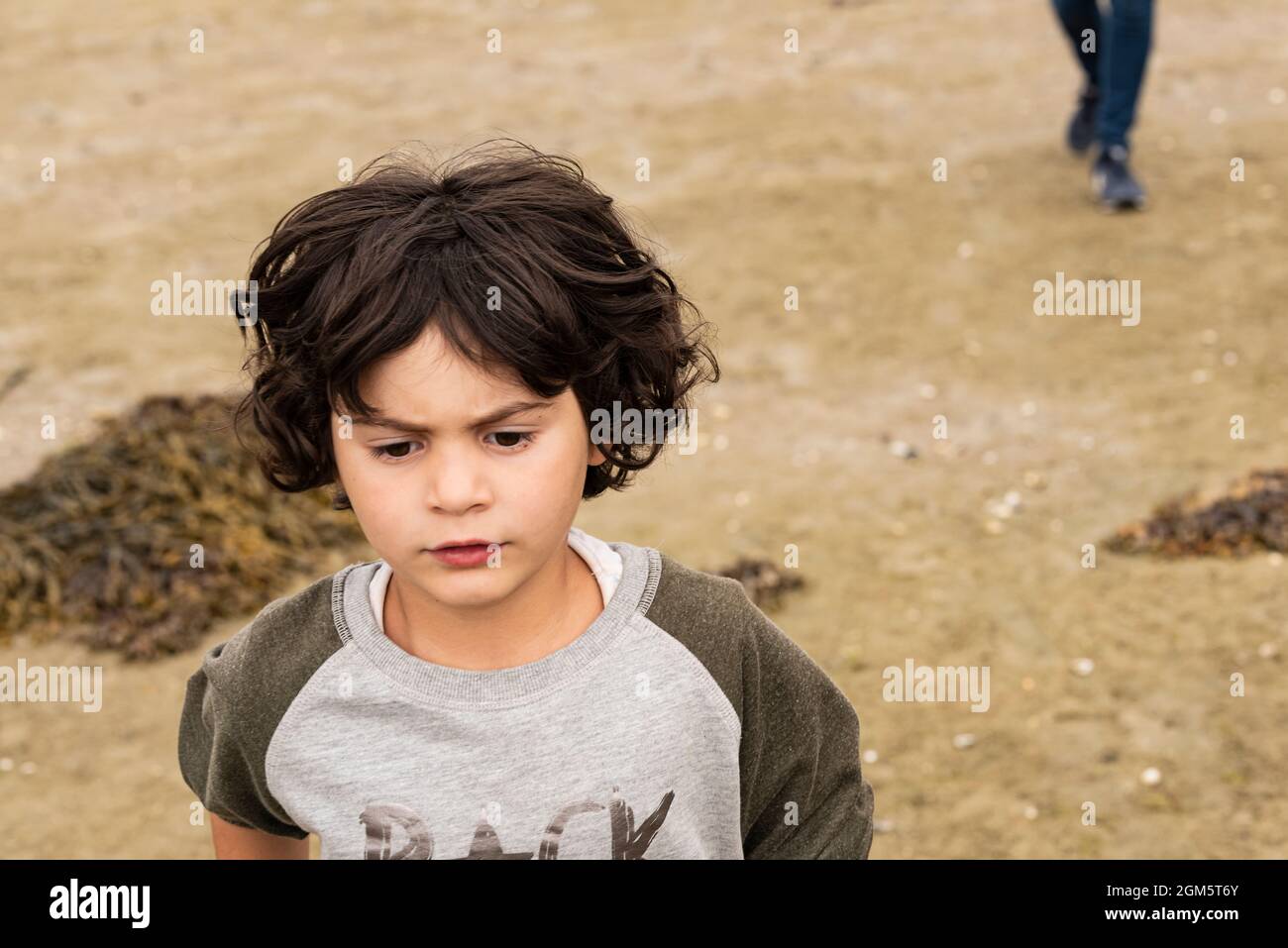 portrait during travel of white caucasian girl with short hair. with cliff and forest in background. Stock Photo