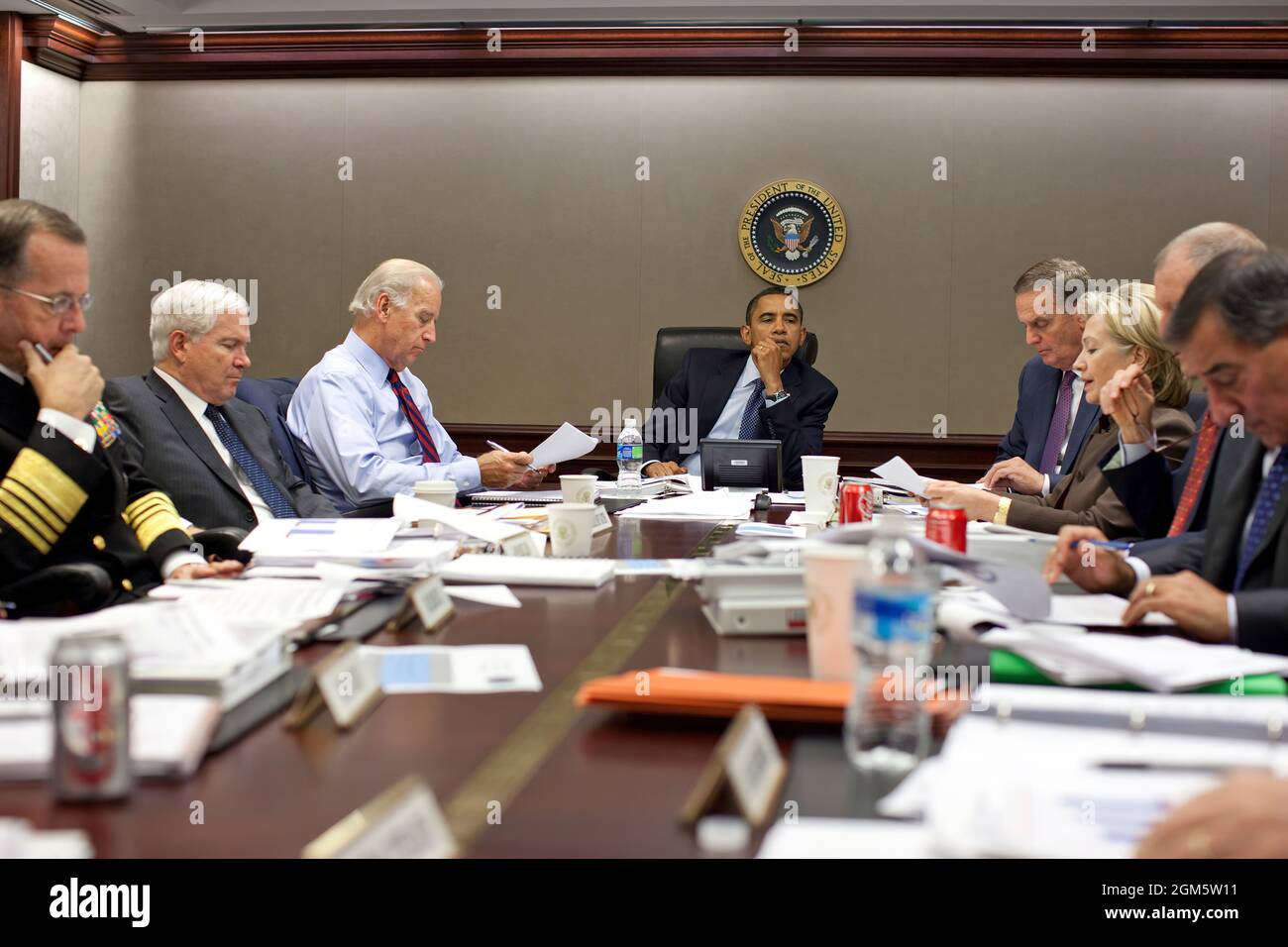 President Barack Obama listens during a meeting about the current situation in Pakistan Oct. 7, 2009 in the Situation Room of the White House. Left to right, Adm. Michael Mullen, chairman of the Joint Chiefs of Staff; Defense Secretary Robert Gates; Vice President Joe Biden; the President; National Security Advisor Gen. James Jones; Secretary of State Hillary Clinton; Director of National Intelligence Adm. Dennis C. Blair (partially obscured); and CIA Director Leon Panetta.(Official White House photo by Pete Souza) Stock Photo