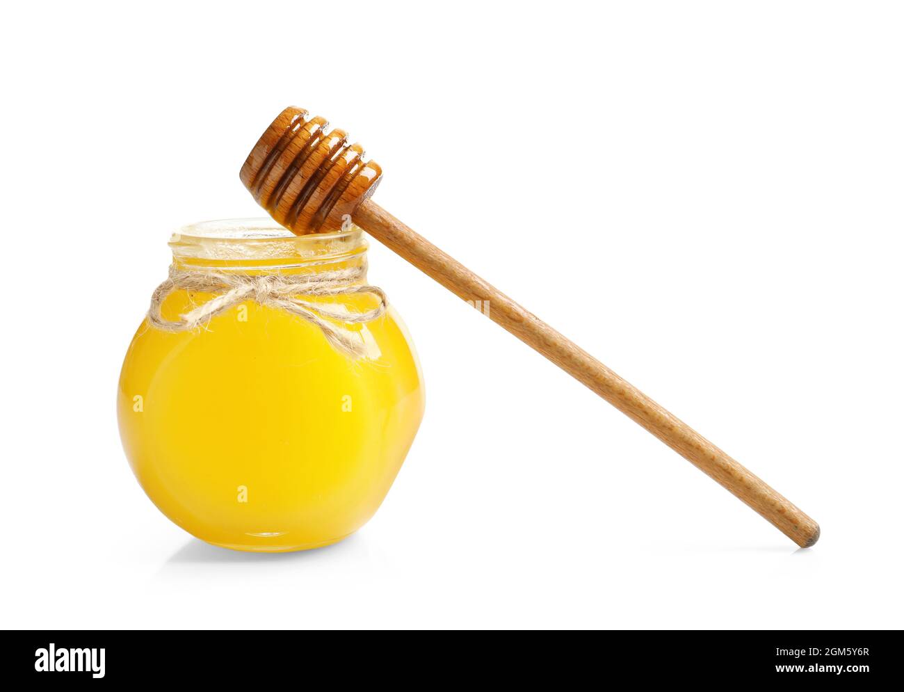 Glass jar with honey and dipper on white background Stock Photo Alamy
