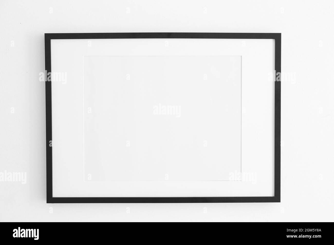 Empty black frame on white wall Stock Photo Alamy