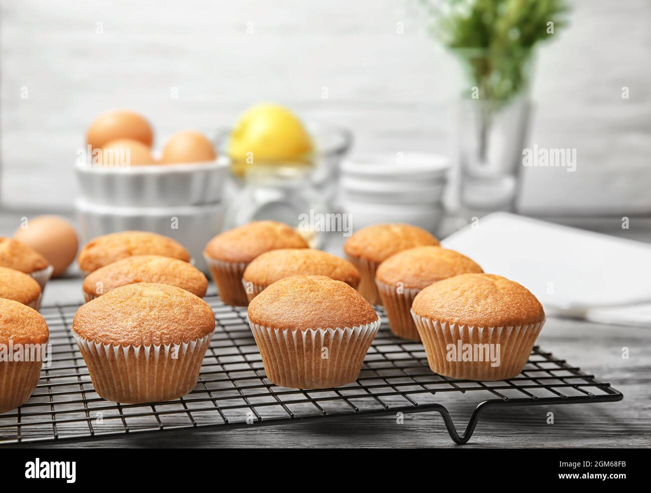 Cooling rack with delicious cupcakes on table, closeup Stock Photo Alamy