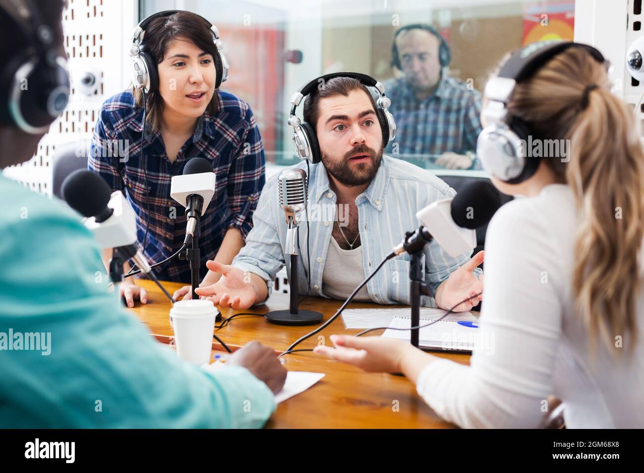 Radio hosts interviewing guest Stock Photo