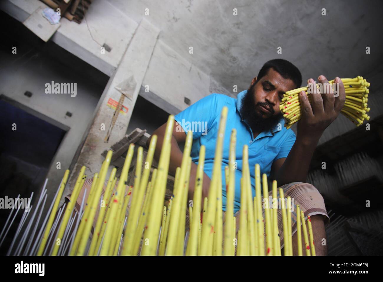 Non Exclusive: An employee works sorting balloons in a balloon factory ...