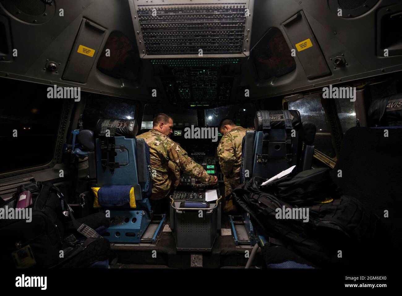 U.S. Air Force Lt. Col. Austin Street, left, 21st Airlift Squadron commander and C-17 Globemaster III pilot, and Capt. Macial St John, 21st AS C-17 pilot, perform a pre-flight checklist aboard a C-17, August 16, 2021, at Travis Air Force Base, California. The U.S. Air Force, in support of the Department of Defense, moved forces into theater to facilitate the safe departure and relocation of U.S. citizens, Special Immigration Visa recipients, and vulnerable Afghan populations from Afghanistan. (U.S Air Force photo by Nicholas Pilch) Stock Photo