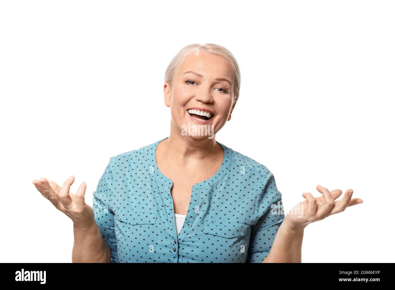 Portrait of smiling mature woman on white background Stock Photo - Alamy
