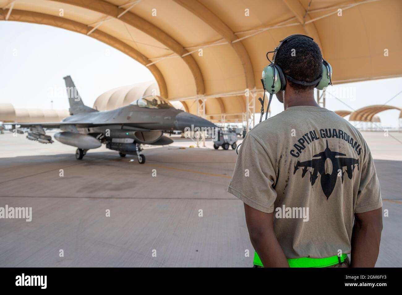 A U.S. Air Force crew chief with the 121st Expeditionary Fighter Generation Squadron conducts a pre-launch inspection on an F-16 Fighting Falcon at Prince Sultan Air Base, Kingdom of Saudi Arabia, Aug. 27, 2021. In addition to logistics and manpower support, the 378th Air Expeditionary Wing provided combat airpower to ensure U.S. Central Command’s air superiority during noncombatant evacuation operations in Afghanistan.  (U.S. Air Force photo by Staff Sgt. Caleb Pavao) Stock Photo