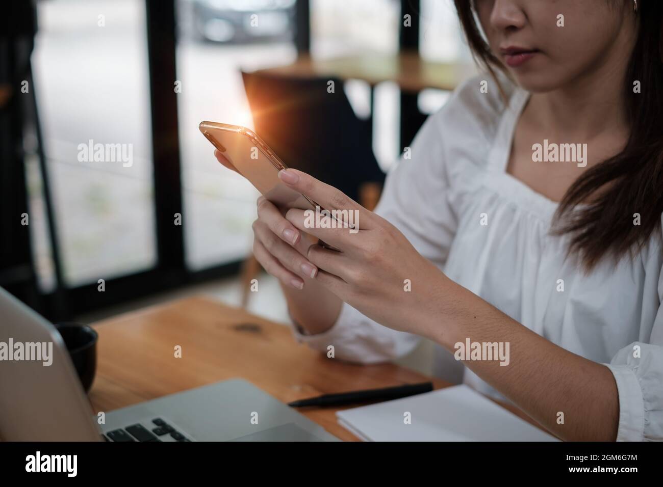 Woman scan her face for KYC security her saving bank account. Biometric data security concept. Stock Photo
