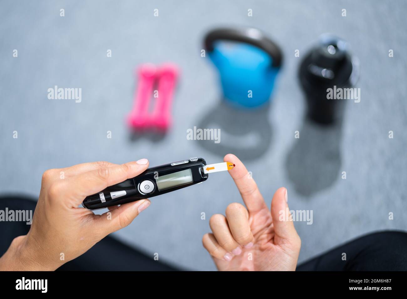Diabetes And Sport. Healthy Lifestyle And Glucometer Stock Photo