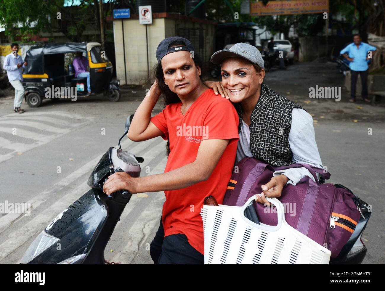 Indian gay men riding a scooter. Stock Photo