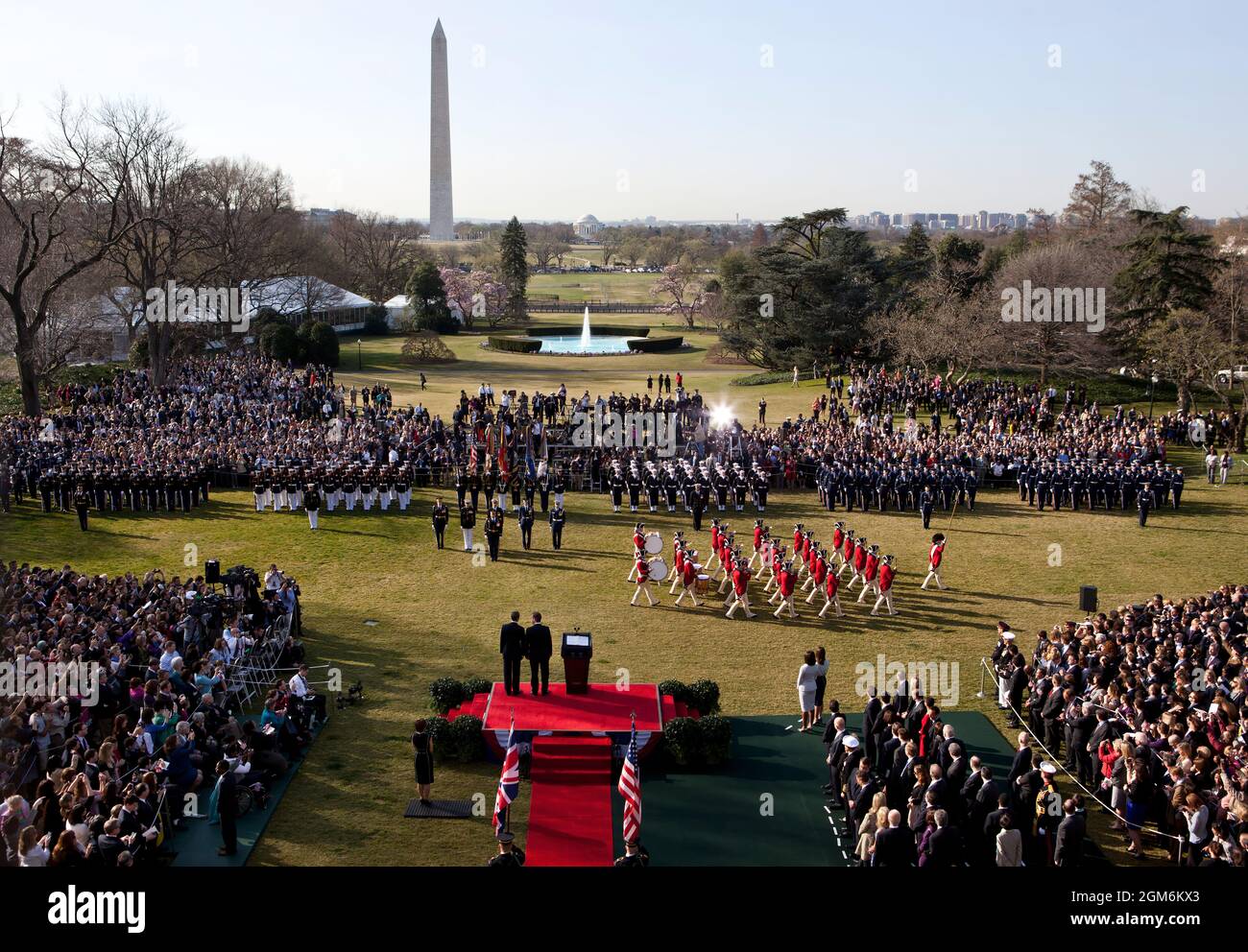 President Barack Obama and Prime Minister David Cameron of the United Kingdom watch the U.S. Army Fife and Drum Corps pass during the Official Arrival Ceremony on the South Lawn, March 14, 2012. (Official White House Photo by Pete Souza) This official White House photograph is being made available only for publication by news organizations and/or for personal use printing by the subject(s) of the photograph. The photograph may not be manipulated in any way and may not be used in commercial or political materials, advertisements, emails, products, promotions that in any way suggests approval or Stock Photo