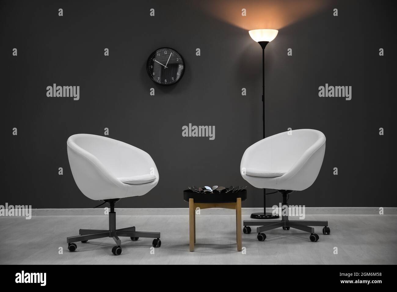 Elegant living room interior with white armchairs Stock Photo - Alamy