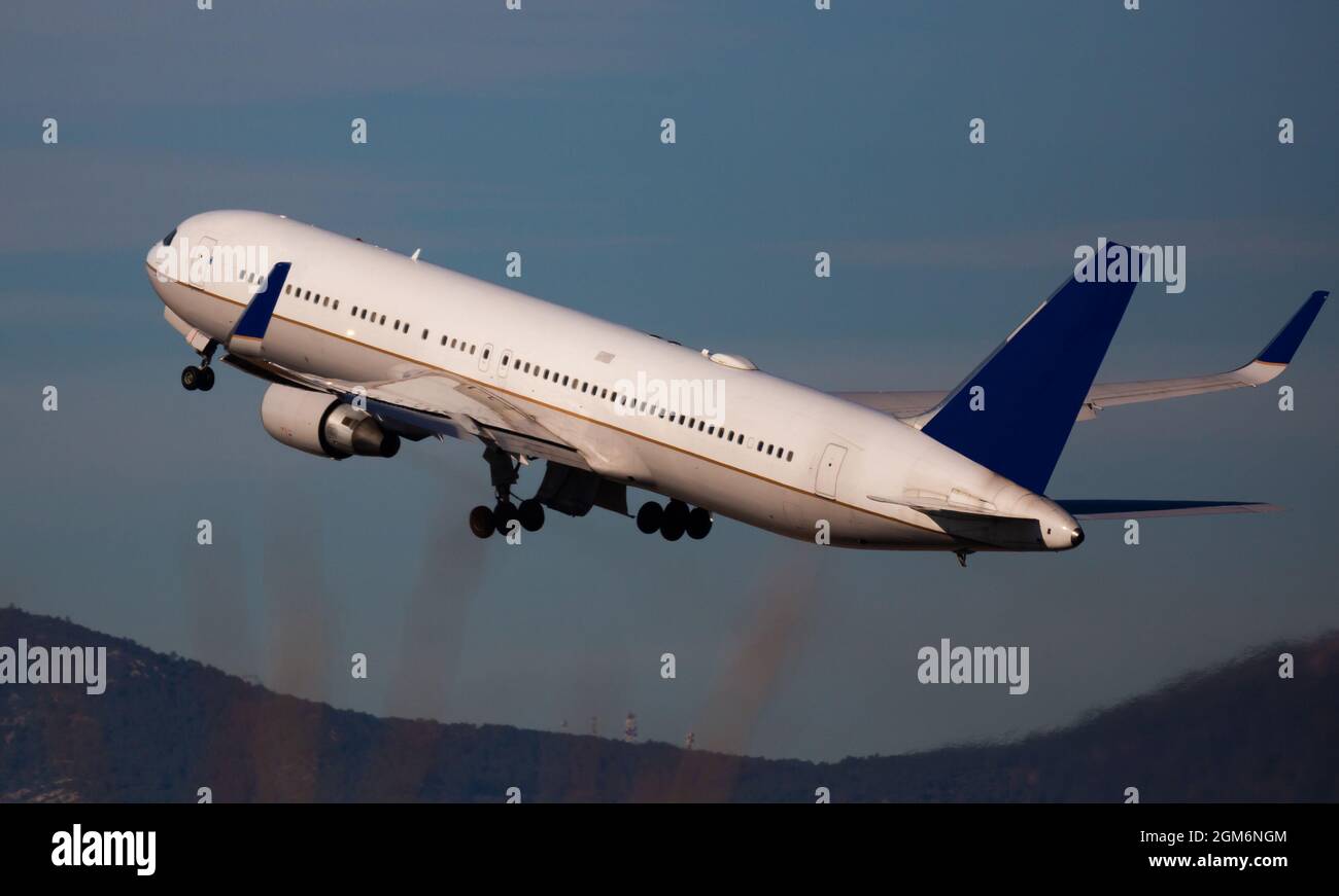 Take off passenger plane in the sky Stock Photo - Alamy