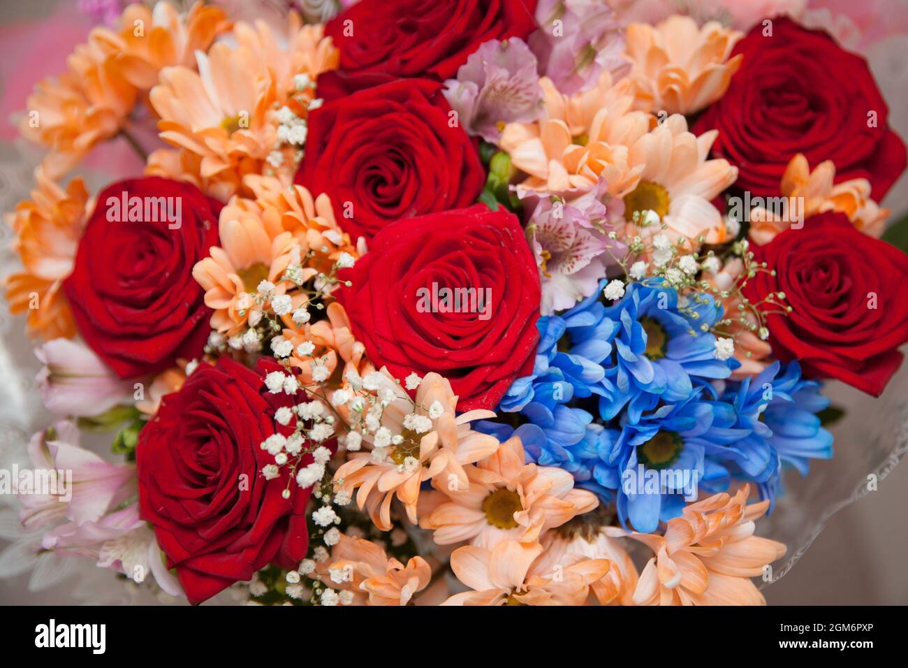 Beautiful bouquet of flowers. Roses and chrysanthemums. Bright flowers. Stock Photo