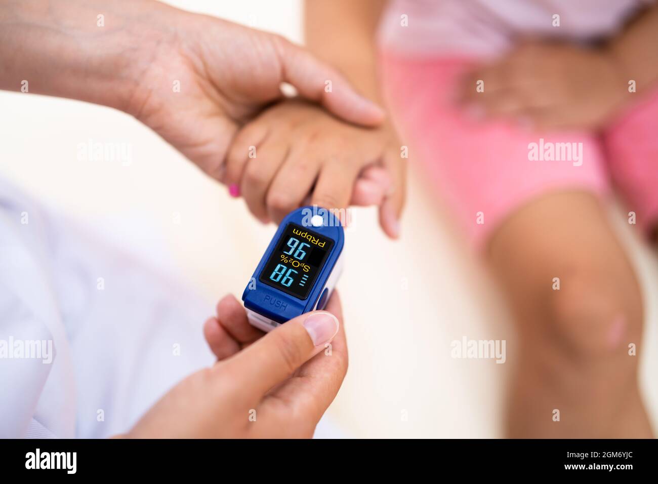 Doctor Checking Child Blood Pulse Using Oximeter Stock Photo Alamy