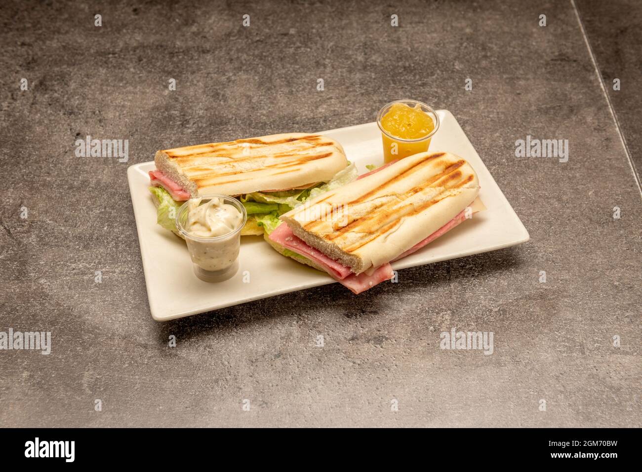 Cuban ham sandwich, cheese tranchete, iceberg lettuce, spreads and