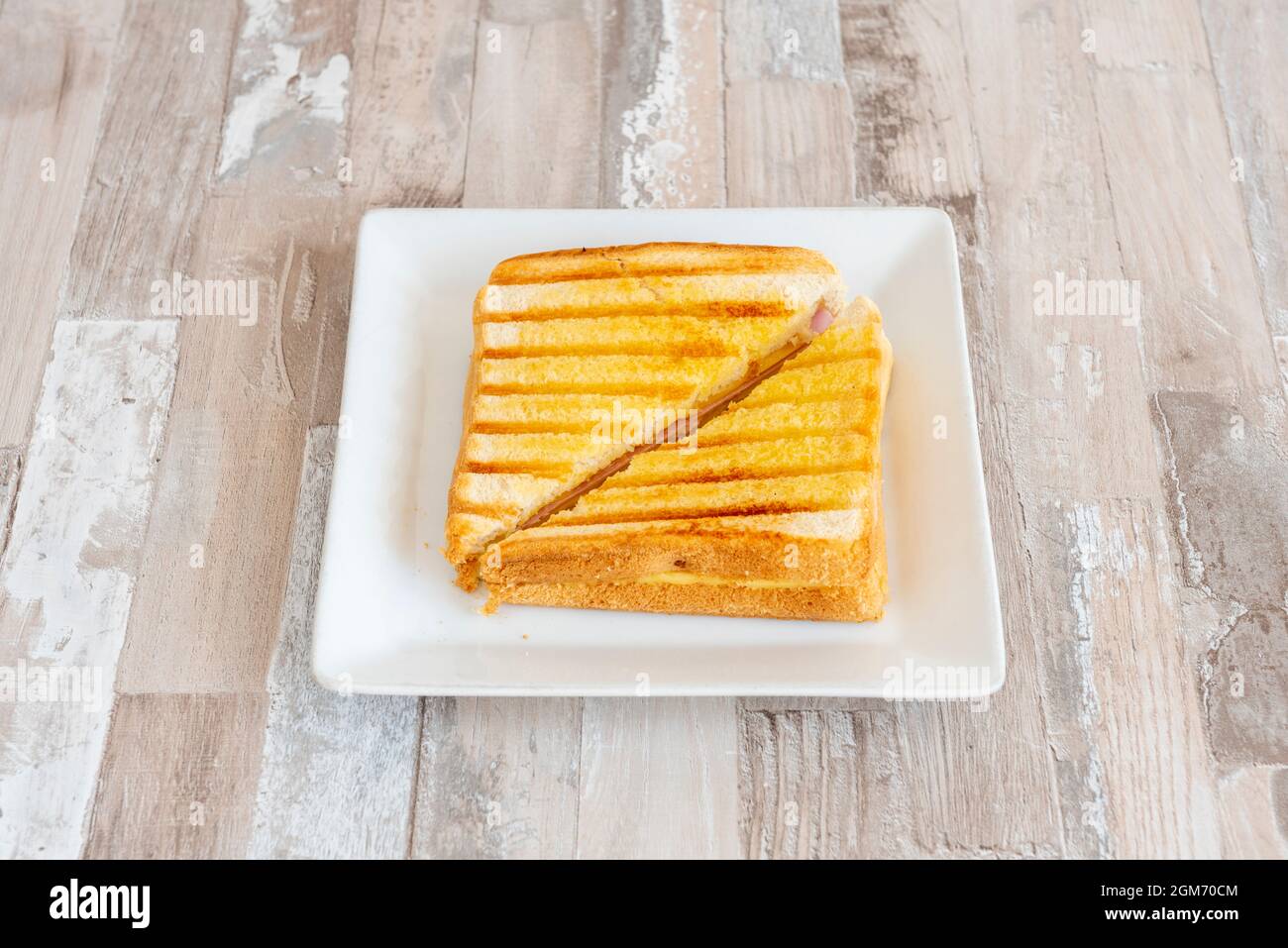 mixed ham and cheese sandwich grilled with a little butter Stock Photo