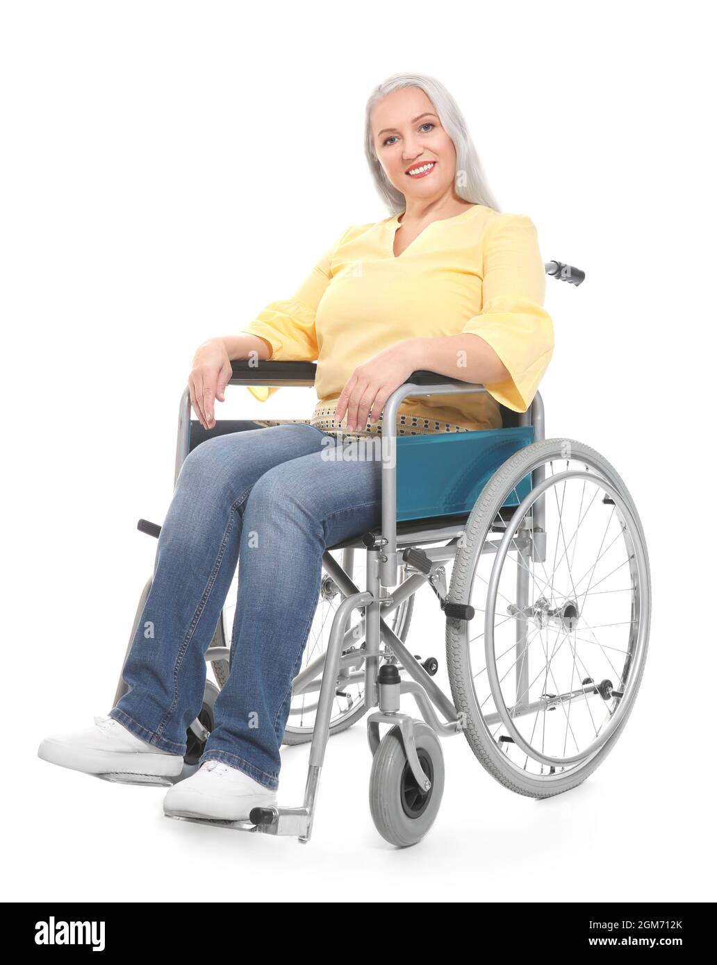 Mature woman in wheelchair on white background Stock Photo - Alamy