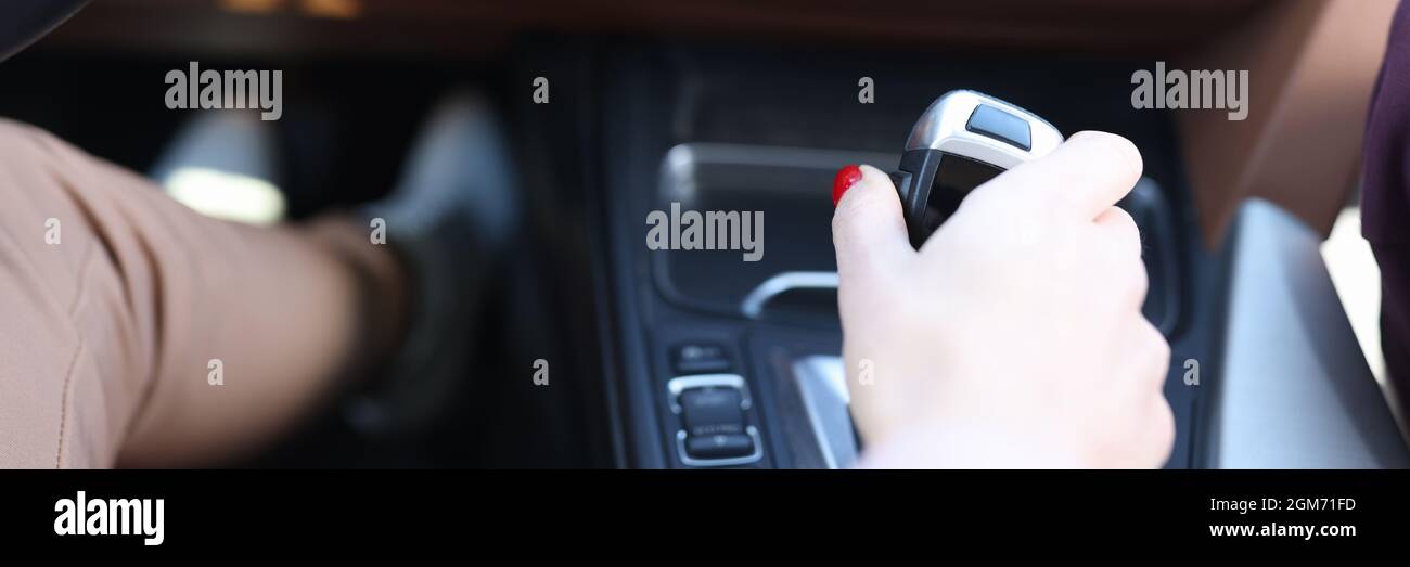 Woman hand holding automatic transmission lever closeup Stock Photo Alamy